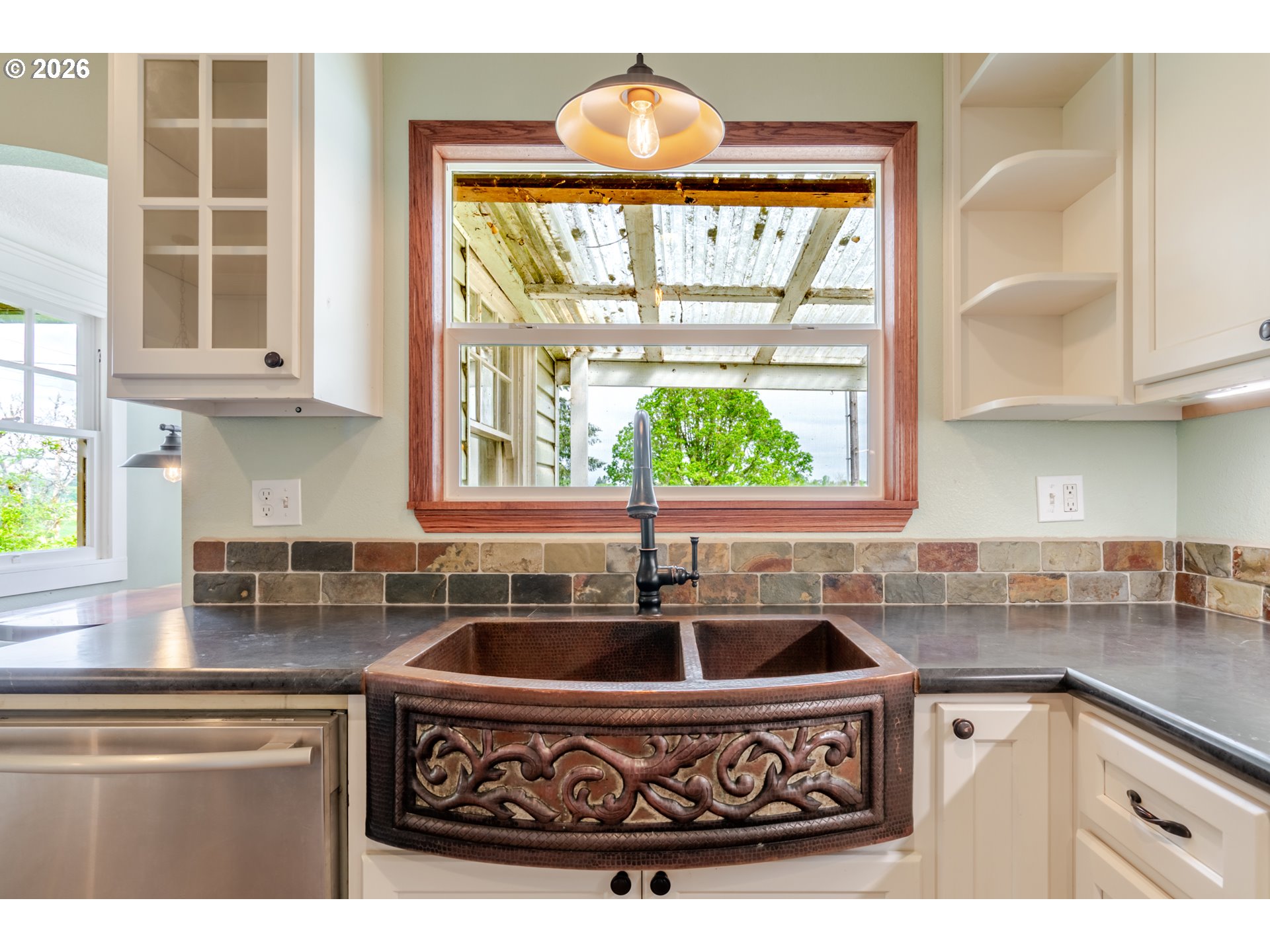 34965 Brewster Road Lebanon, OR 97355 - Photo 14 of 48 a kitchen with a sink a counter top space and a window