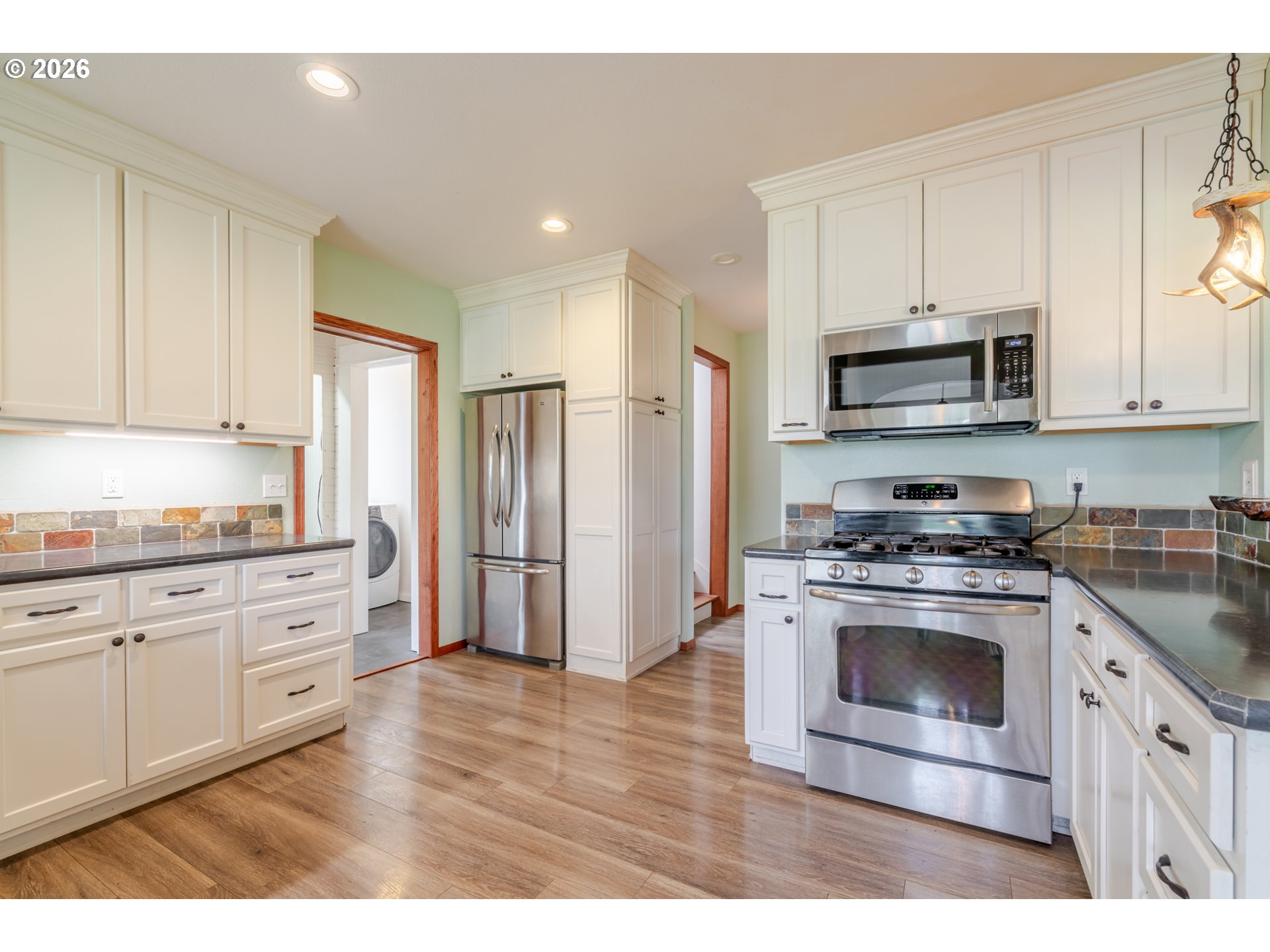 34965 Brewster Road Lebanon, OR 97355 - Photo 15 of 48 a kitchen with stainless steel appliances granite countertop a stove a sink and a refrigerator