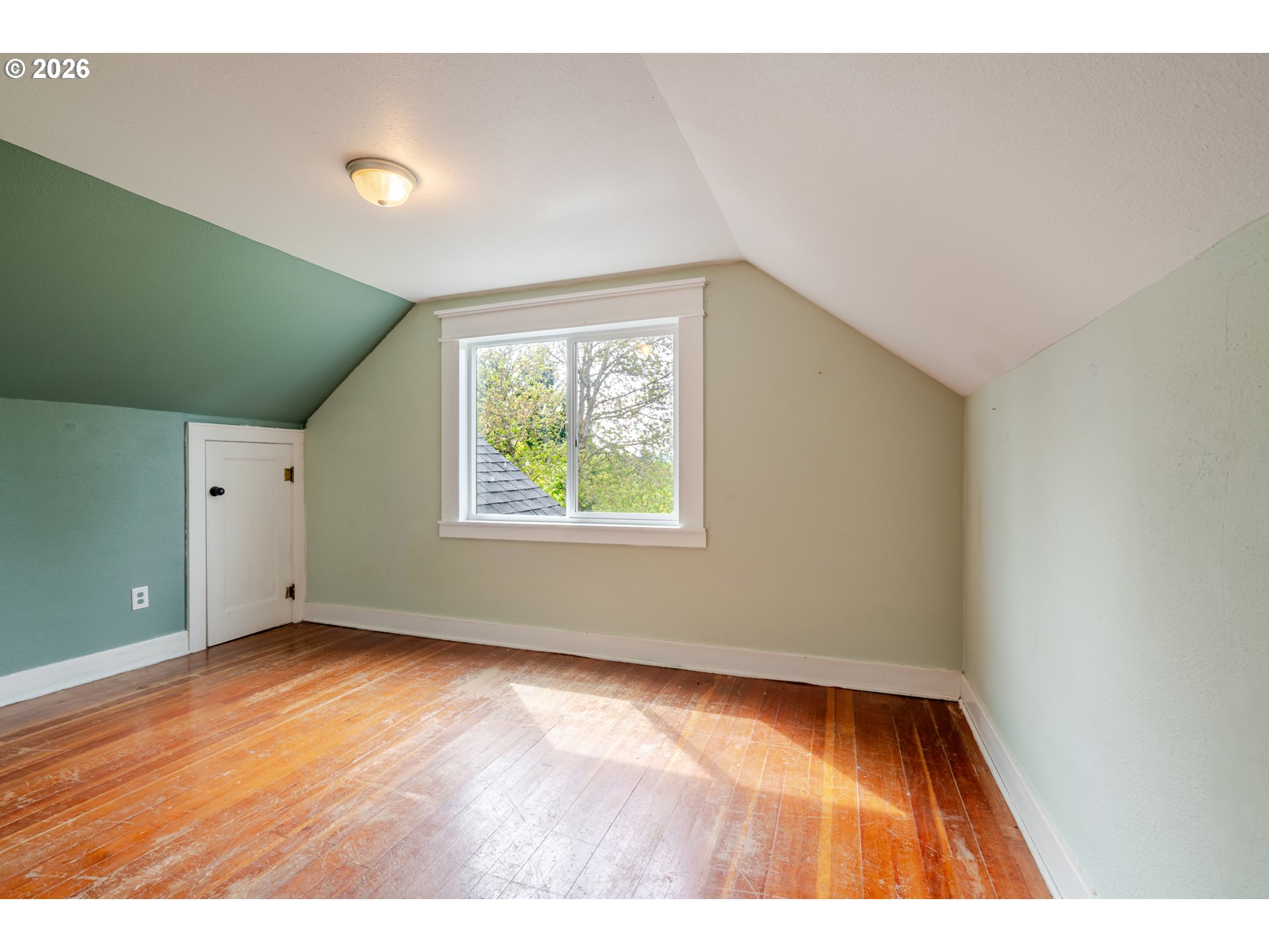 34965 Brewster Road Lebanon, OR 97355 - Photo 22 of 48 an empty room with wooden floor and windows