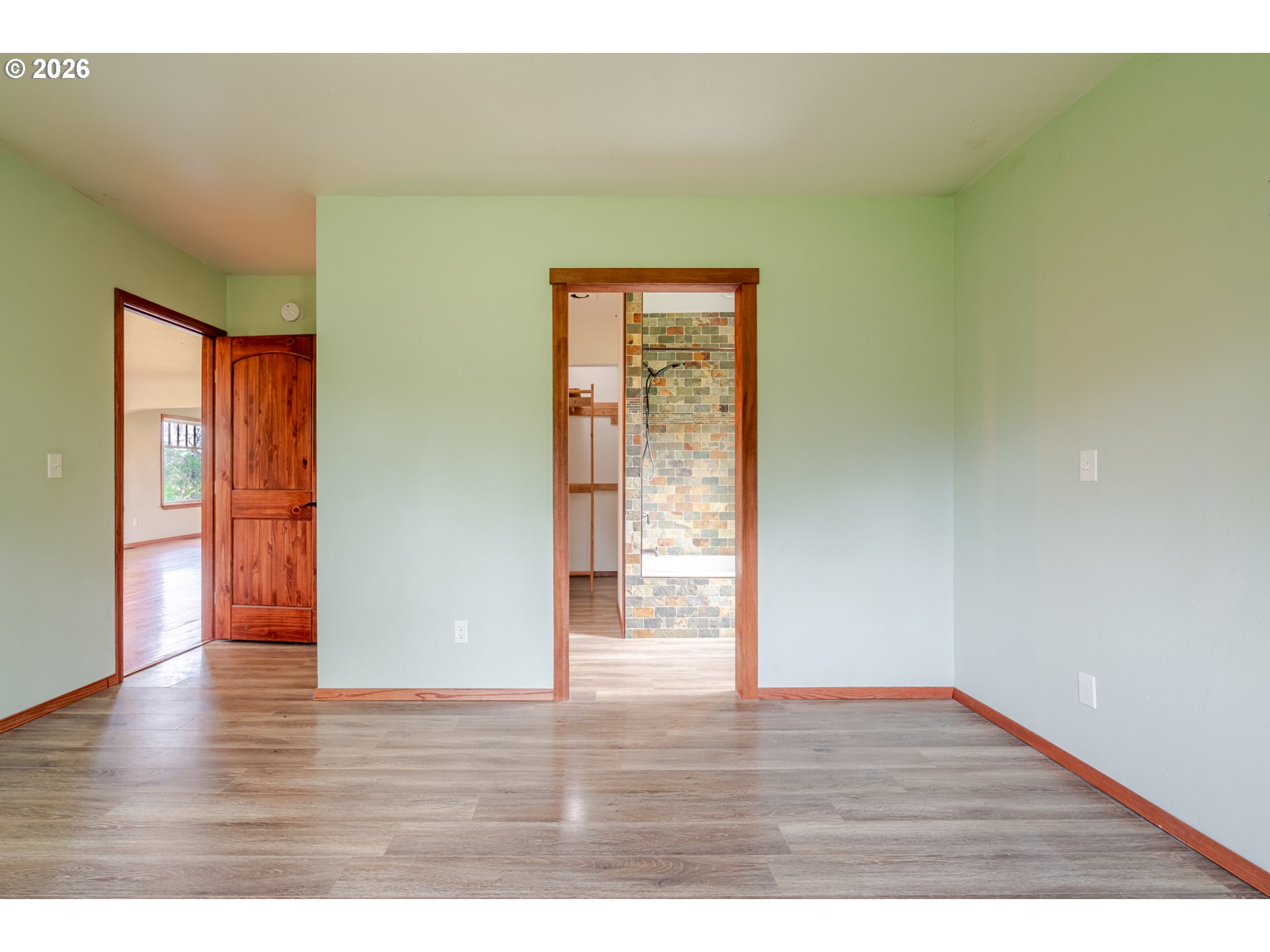 34965 Brewster Road Lebanon, OR 97355 - Photo 28 of 48 a view of an empty room with wooden floor