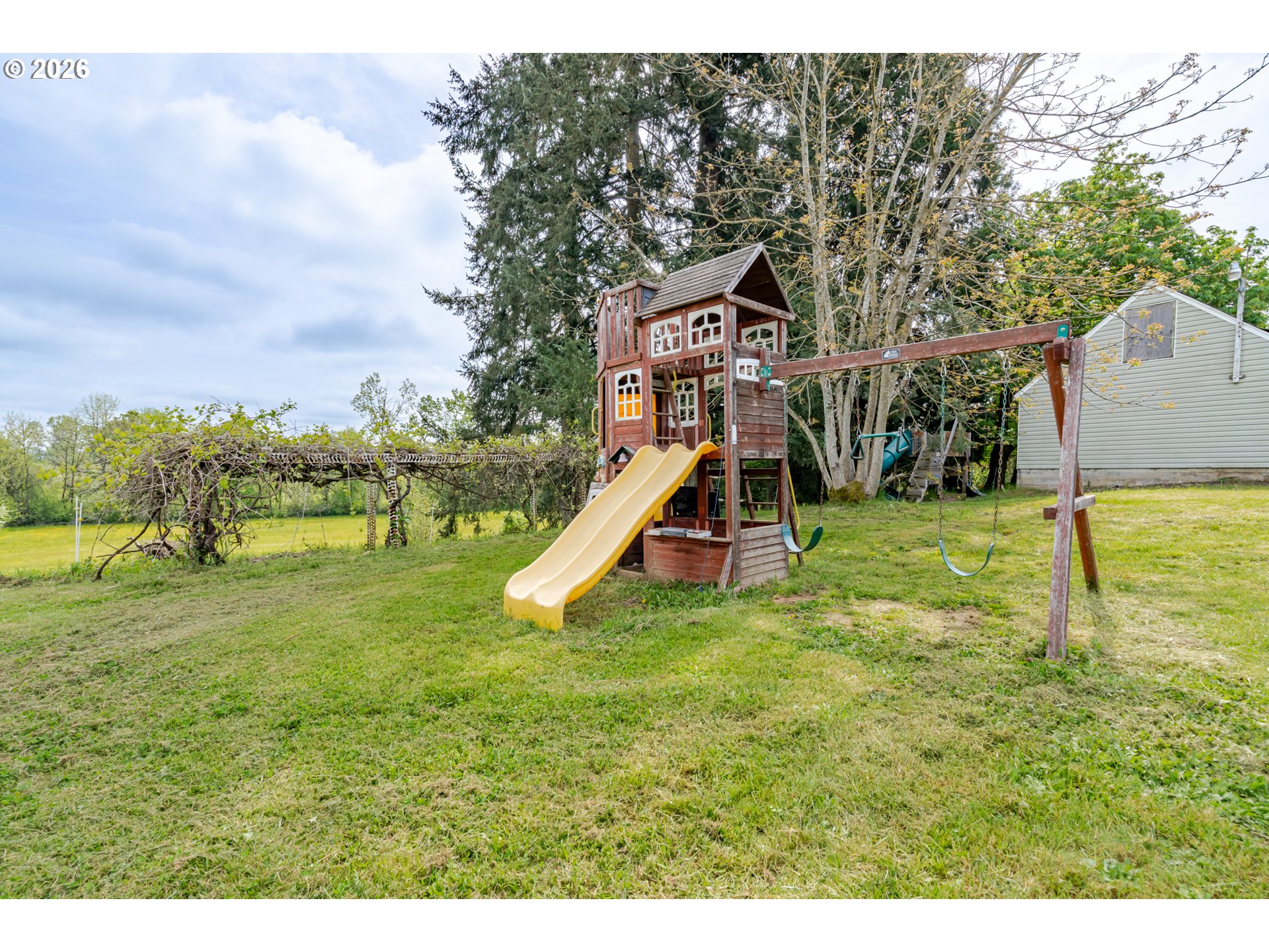 34965 Brewster Road Lebanon, OR 97355 - Photo 40 of 48 a view of a garden with a slide