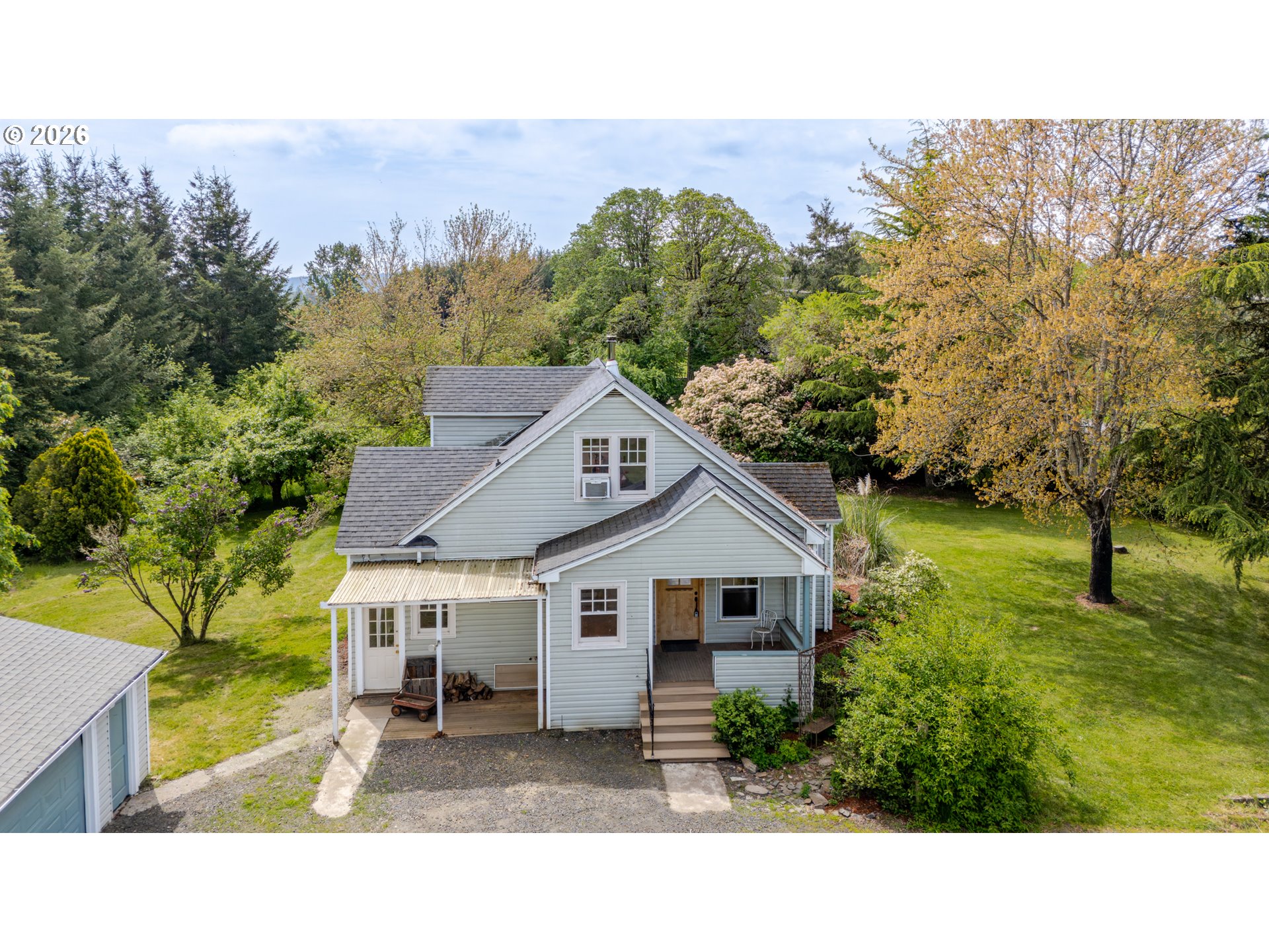 34965 Brewster Road Lebanon, OR 97355 - Photo 4 of 48 a aerial view of a house with a yard