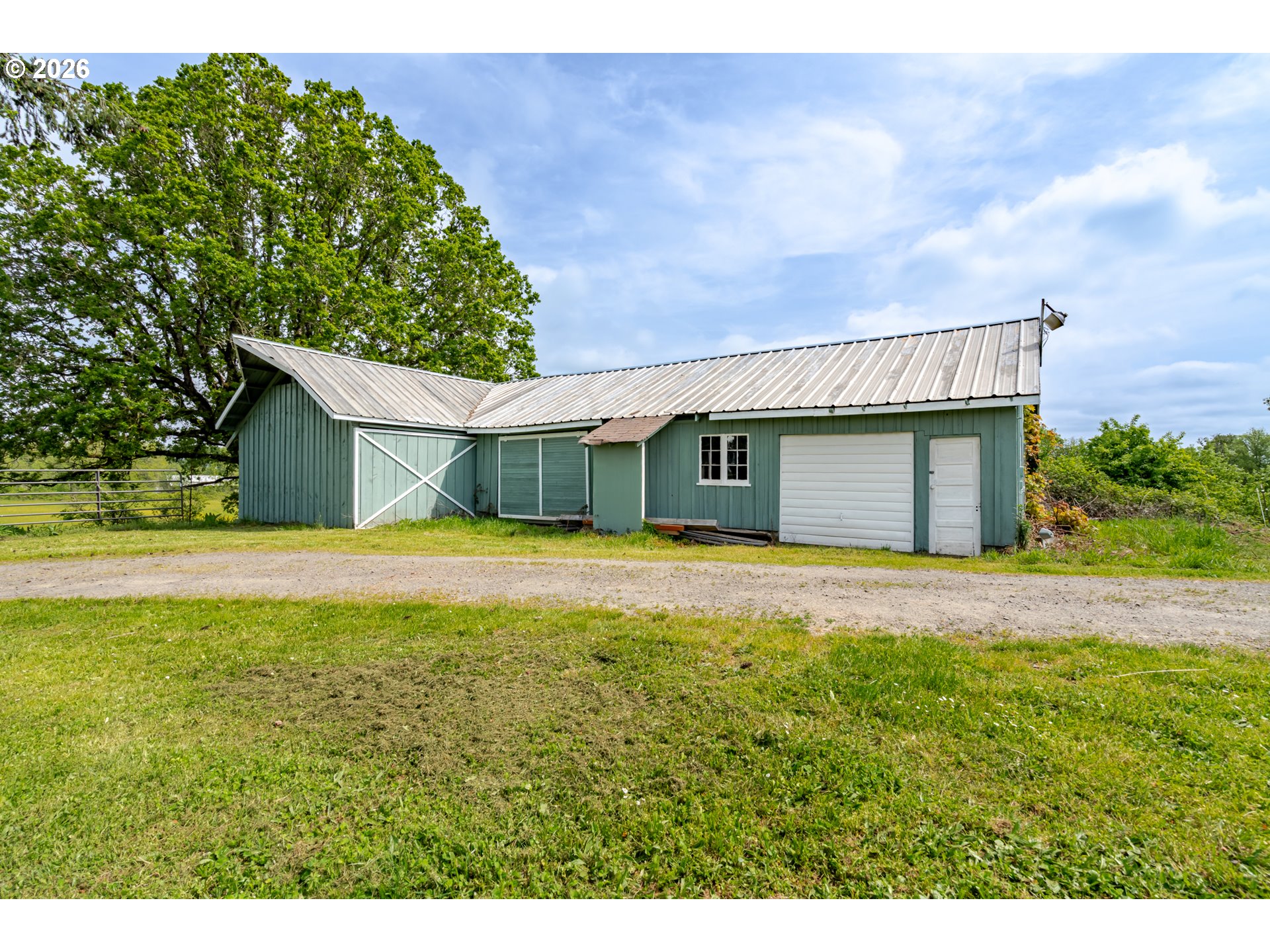 34965 Brewster Road Lebanon, OR 97355 - Photo 45 of 48 a front view of a house with a garden