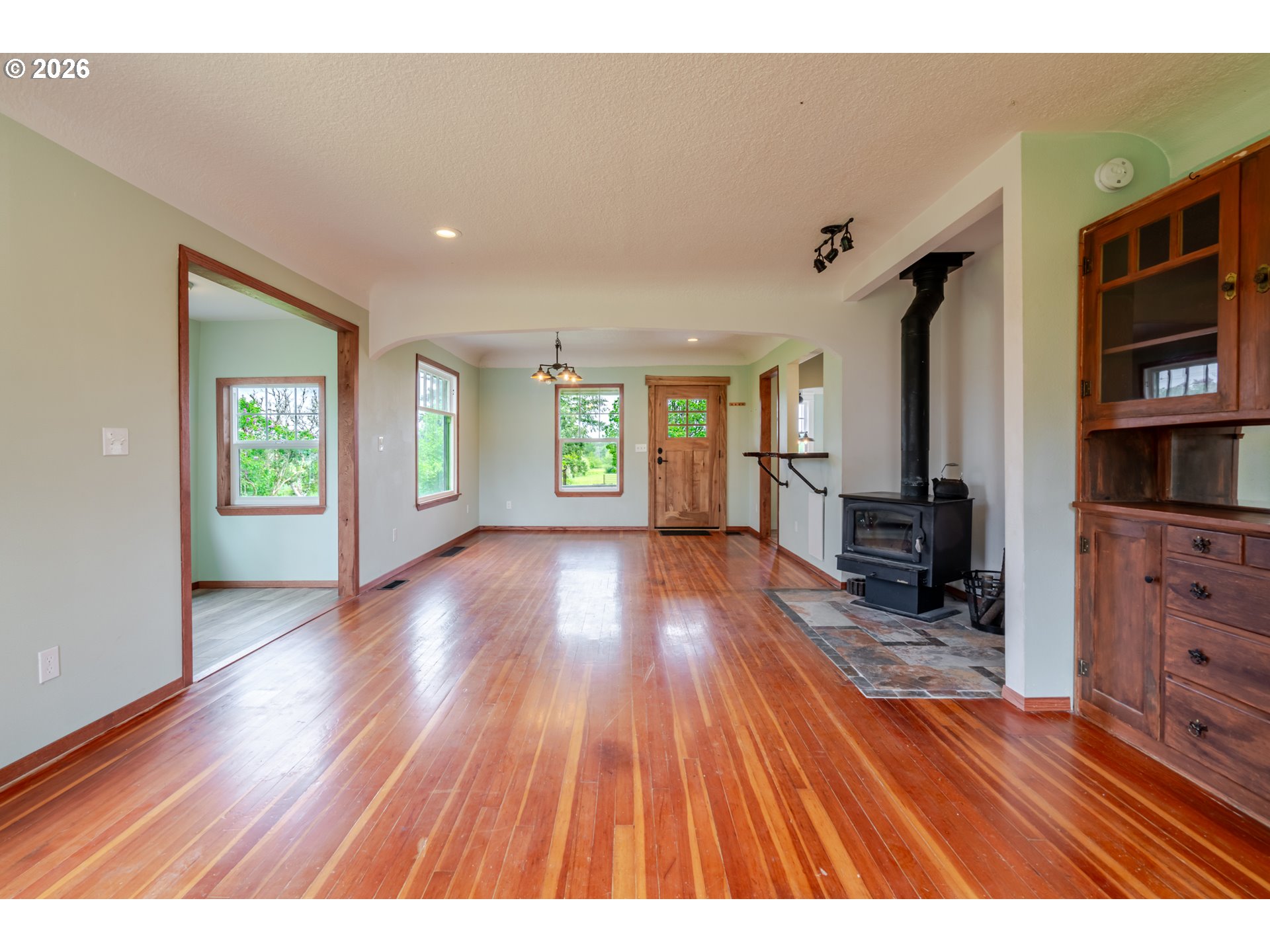 34965 Brewster Road Lebanon, OR 97355 - Photo 10 of 48 wooden floor in an empty room with a window