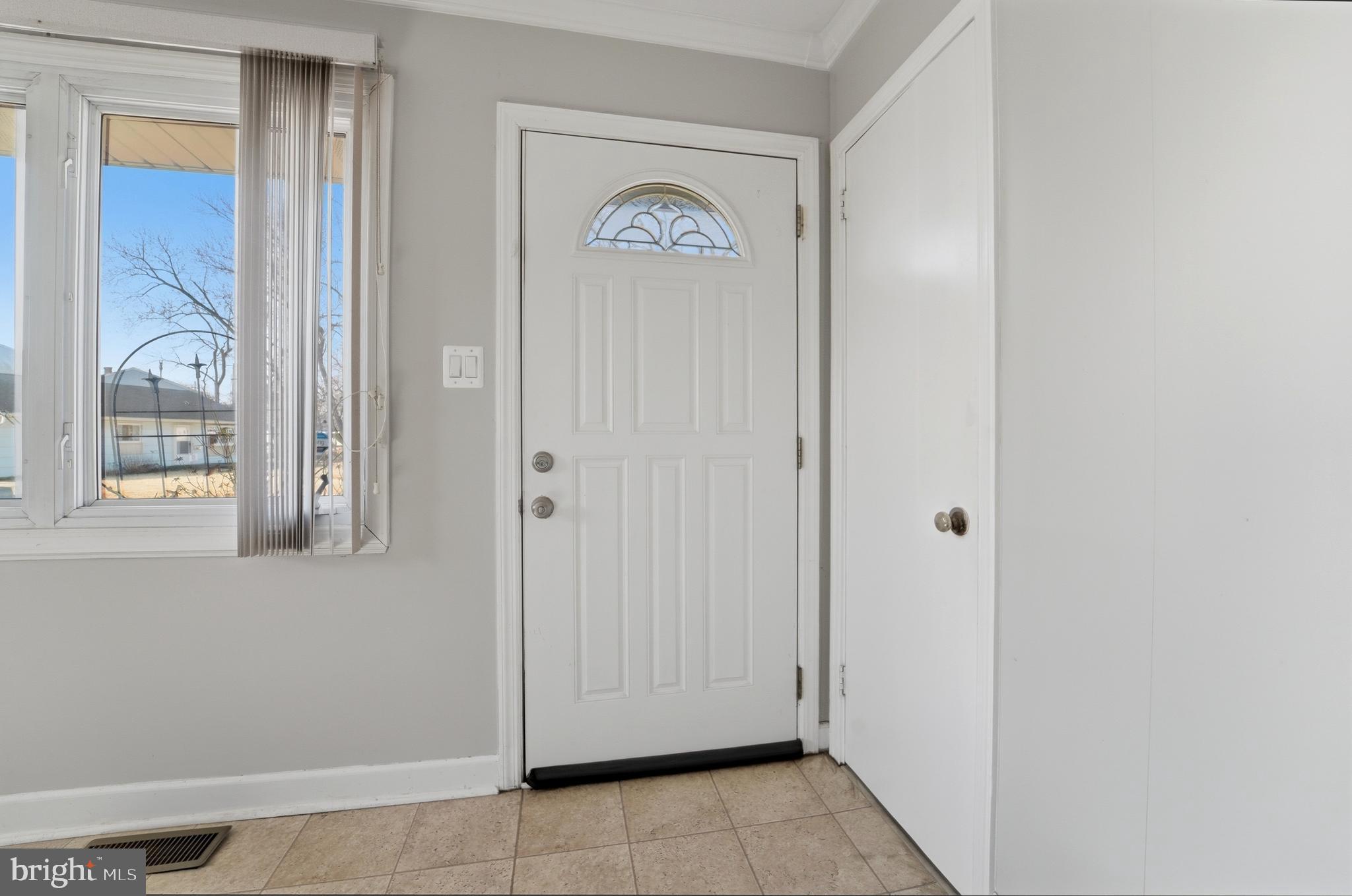 762 224th Street Pasadena, MD 21122 - Photo 3 of 34 a view of an entryway with wooden floor