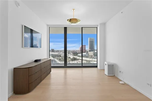 a view of an empty room with a window