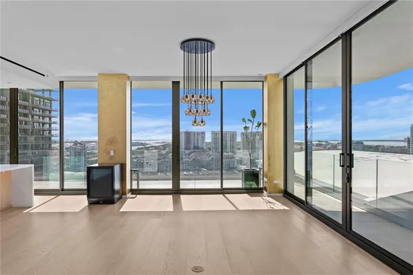 a view of an empty room with windows