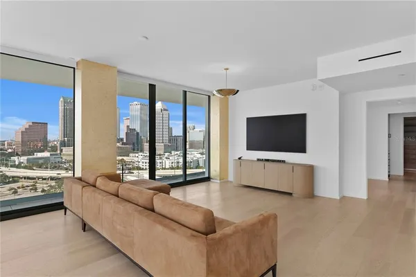 a living room with furniture and a large window