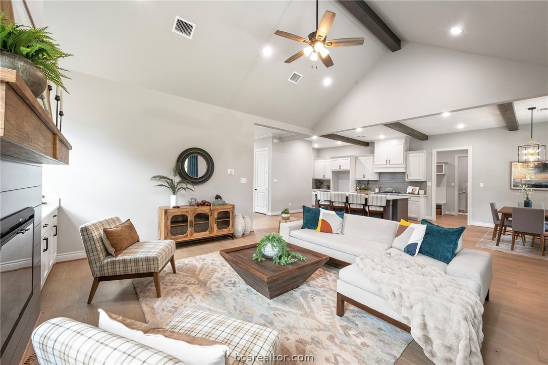 13291 Hopes Creek Road College Station, TX 77845 - Photo 2 of 45 Living room featuring beamed ceiling, ceiling fan, recessed lighting, wood finished floors, and high vaulted ceiling