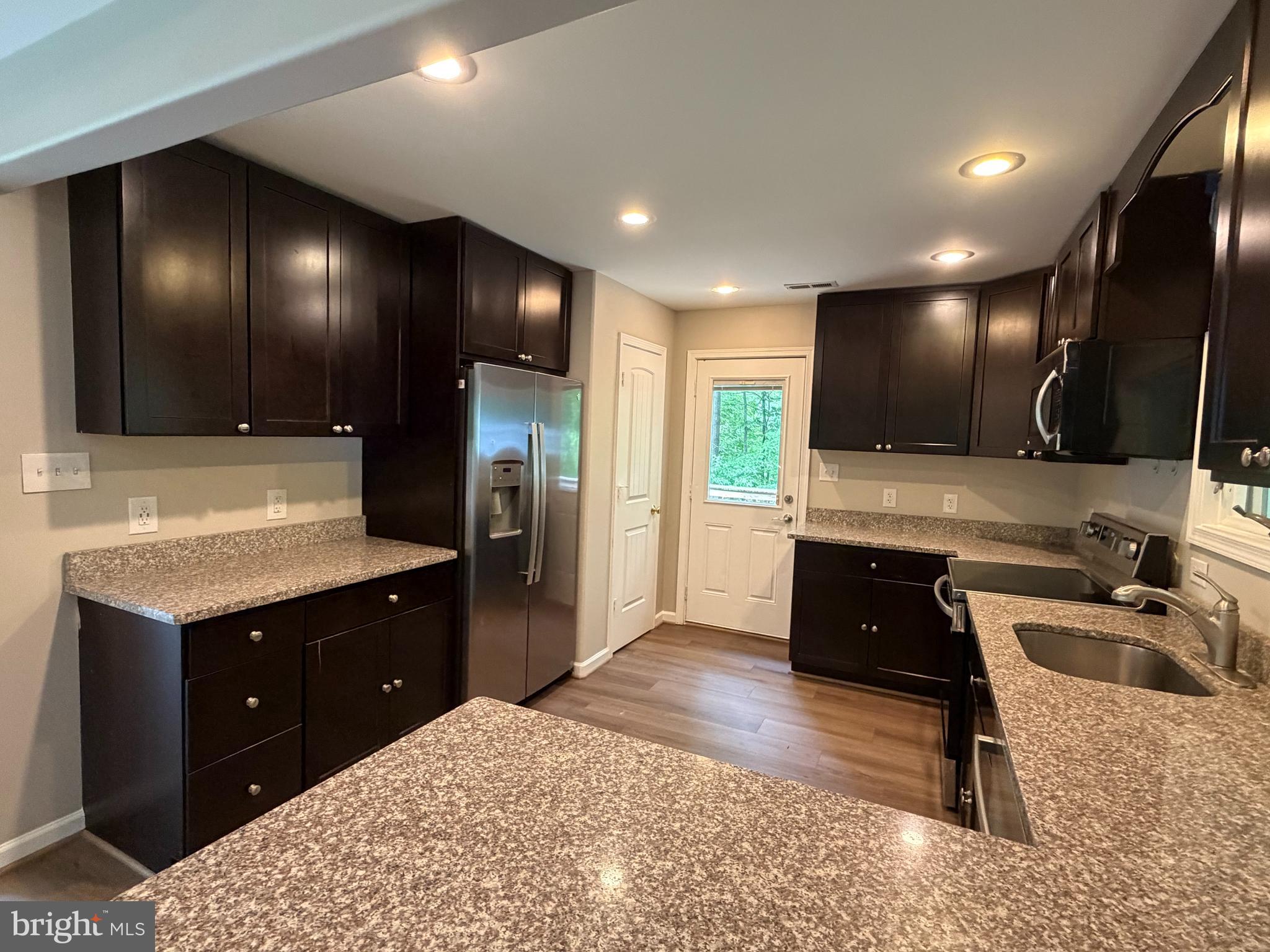 146 Trillium Trail Road Linden, VA 22642 - Photo 6 of 21 a kitchen with a refrigerator and a sink