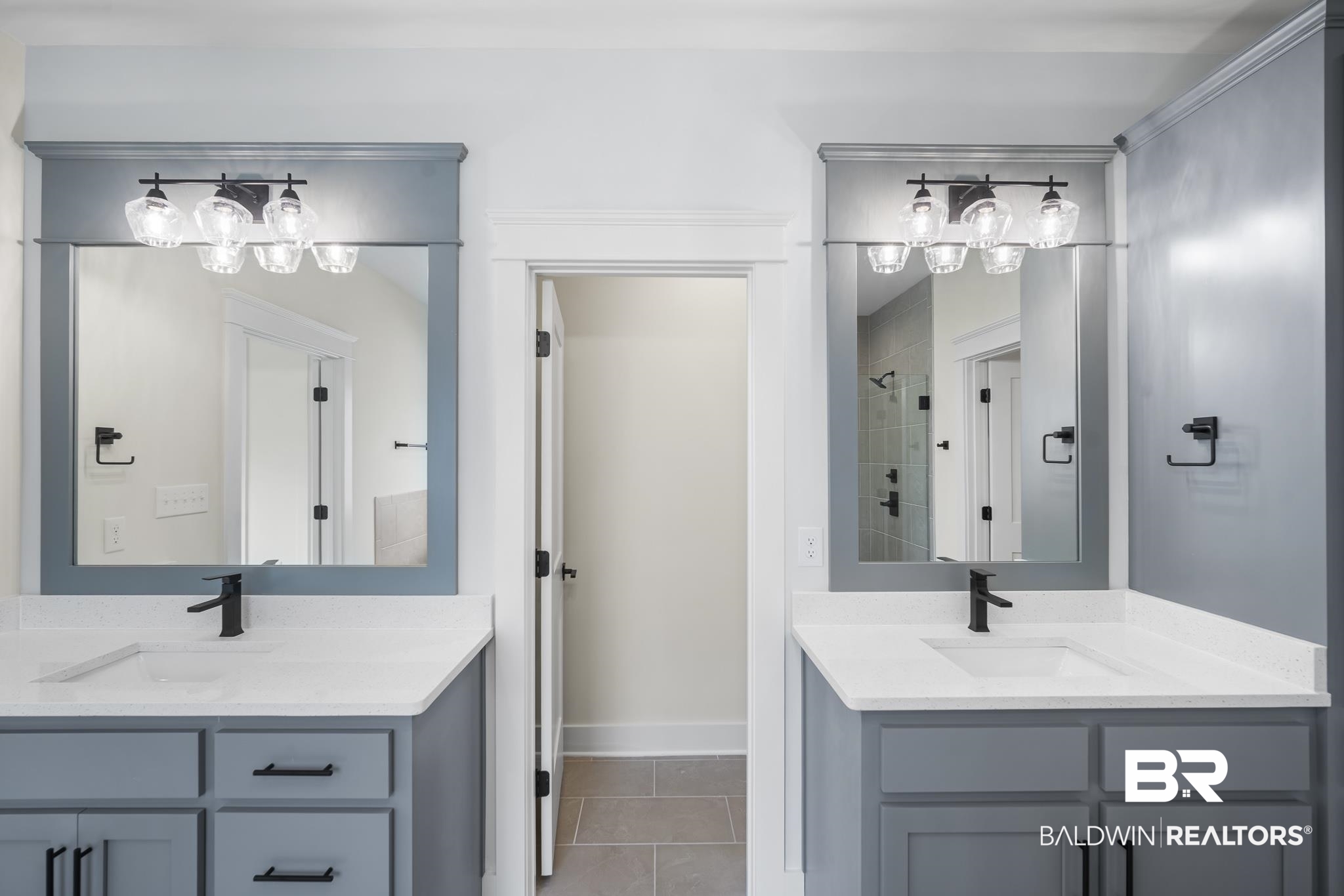 21826 Veranda Boulevard Fairhope, AL 36532 - Photo 18 of 42 Bathroom with a shower stall, tile patterned floors, and two vanities