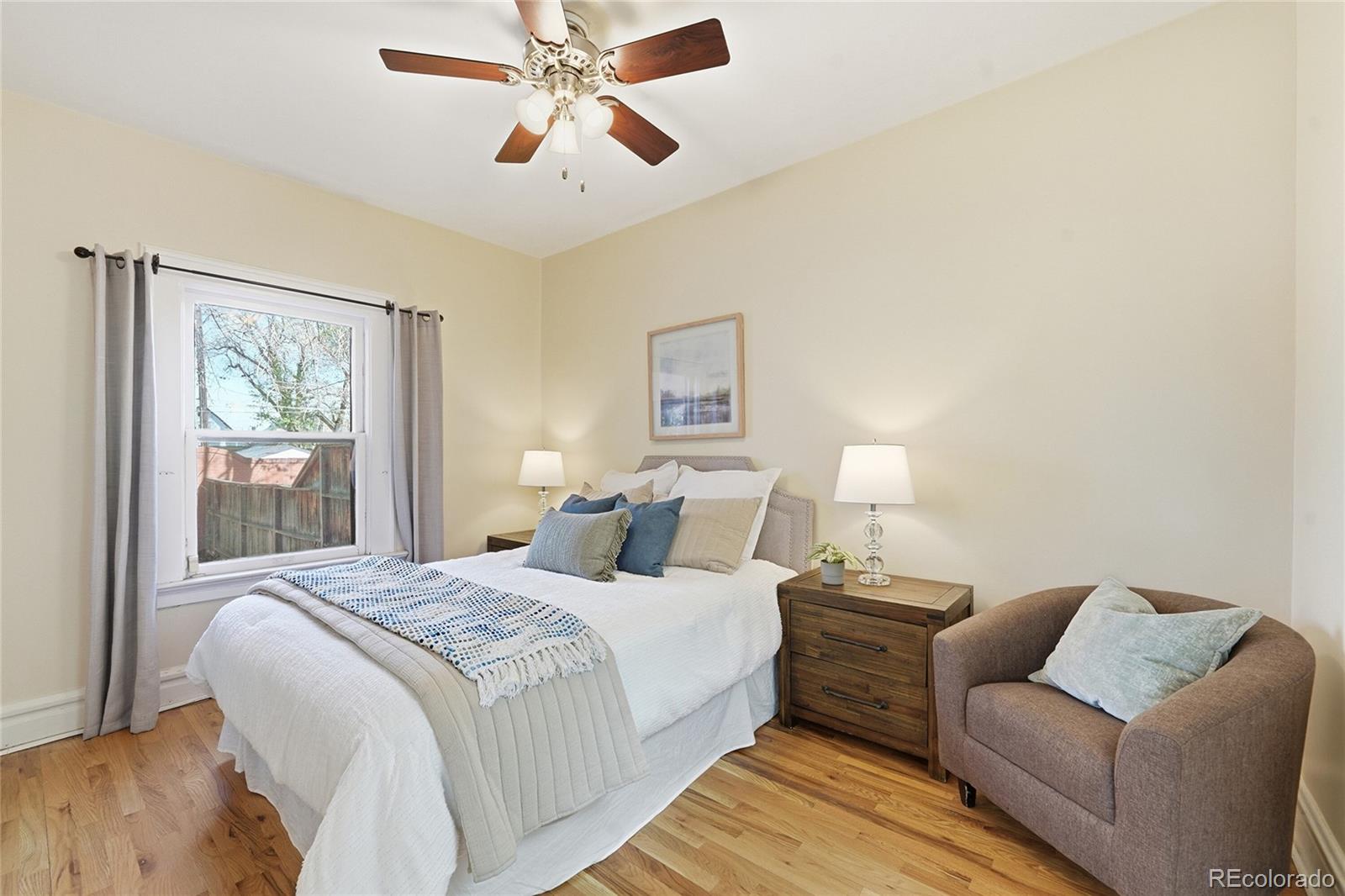 3294 Quitman Street Denver, CO 80212 - Photo 13 of 39 a bedroom with a bed and wooden floor