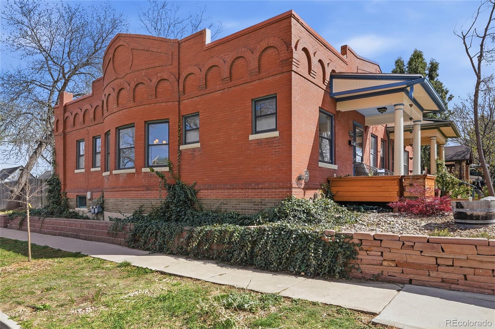 3294 Quitman Street Denver, CO 80212 - Photo 2 of 39 a front view of a house with a yard