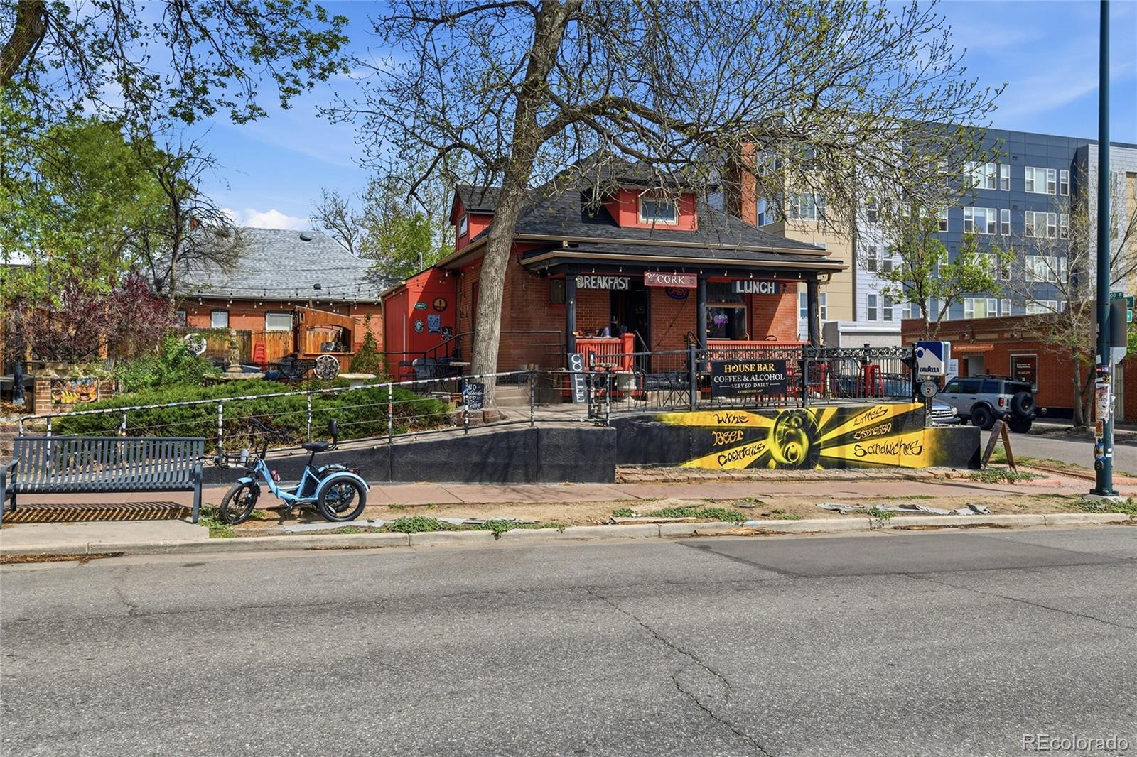 3294 Quitman Street Denver, CO 80212 - Photo 25 of 39 a view of a fountain with a bench in front of building