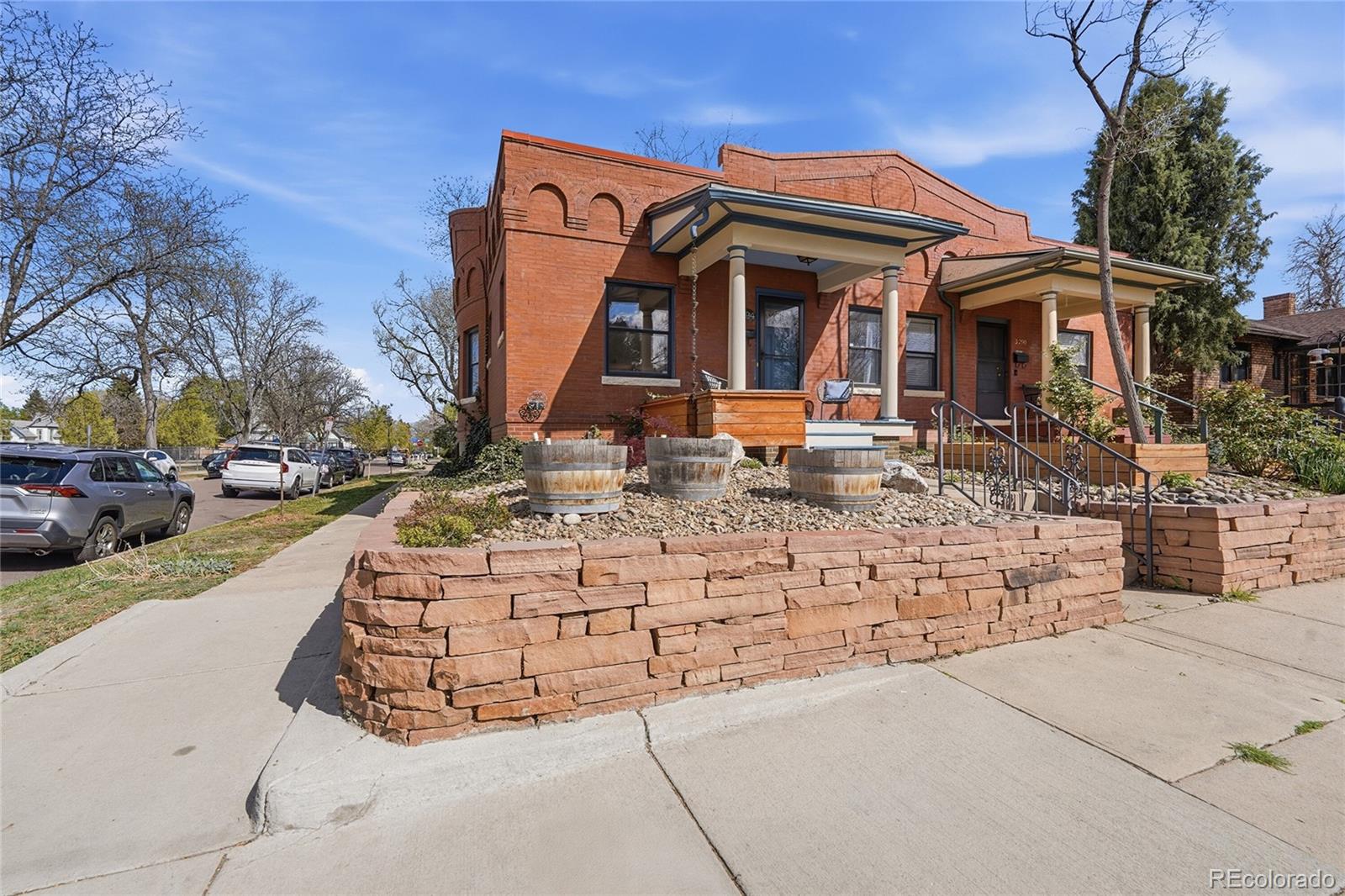 3294 Quitman Street Denver, CO 80212 - Photo 3 of 39 a front view of a house with garden