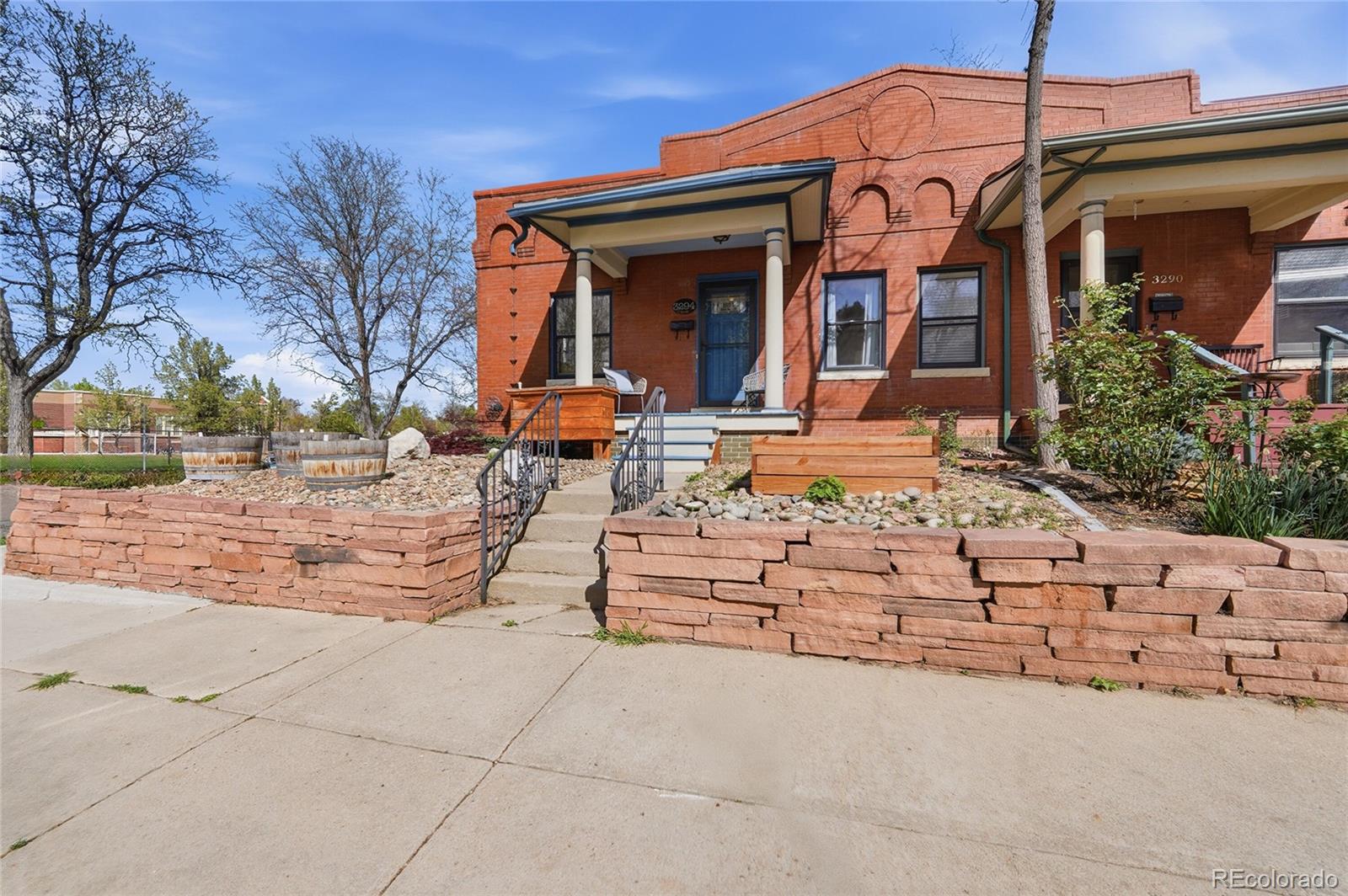 3294 Quitman Street Denver, CO 80212 - Photo 4 of 39 a view of a house with a yard and pathway