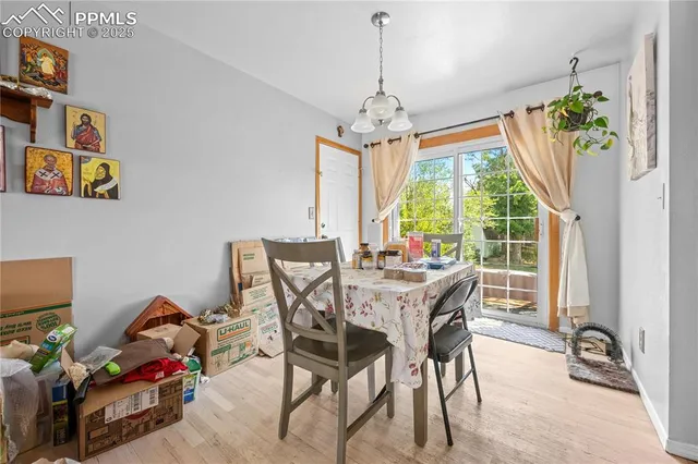 a view of a dining room with furniture window and outside view