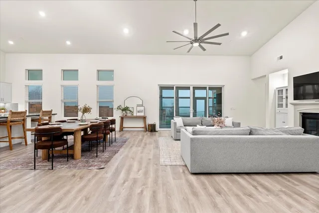 a large kitchen with a table and chairs