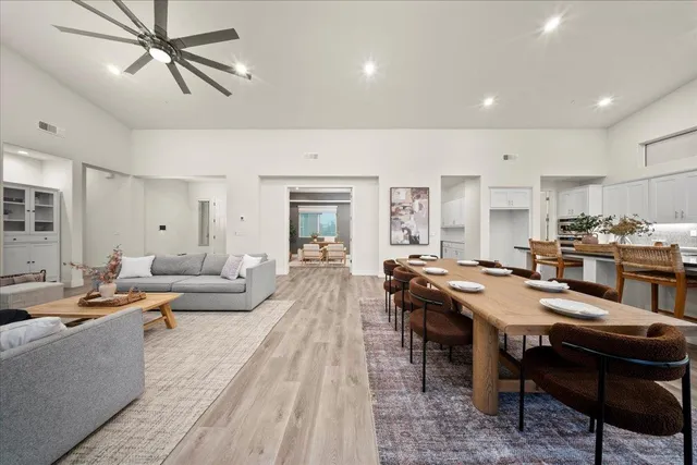 a kitchen with furniture and wooden floor