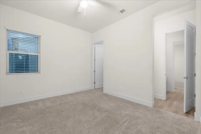 a bathroom with a sink a toilet and a large mirror