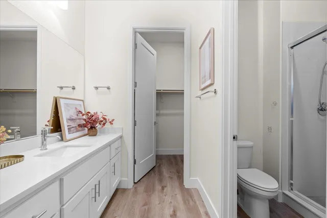 a bathroom with a shower and toilet