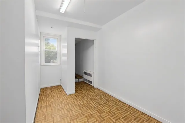 a view of a room with a hallway