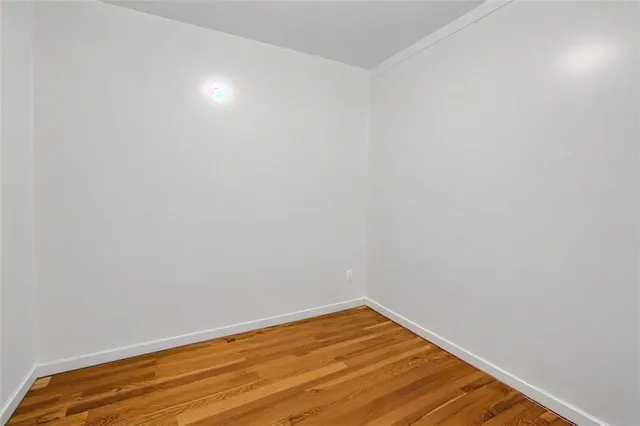 a view of room with wooden floor