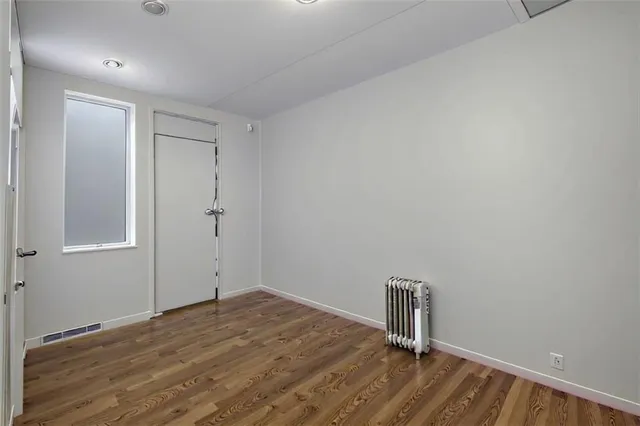 a kitchen with a refrigerator and a sink