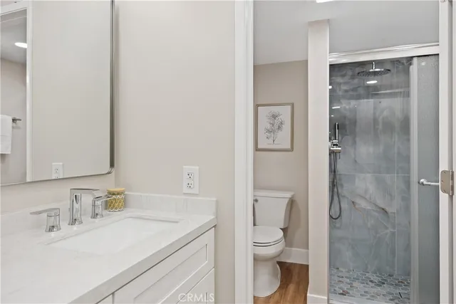 a bathroom with a sink double vanity and a mirror