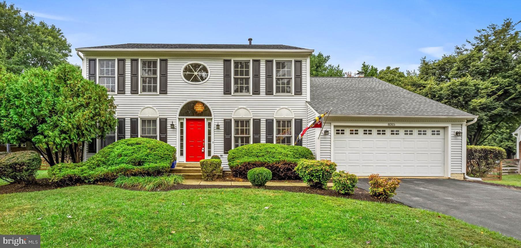 8315 Saddle Ridge Terrace Ellicott City, MD 21043 - Photo 1 of 62 a front view of a house with a yard and garage
