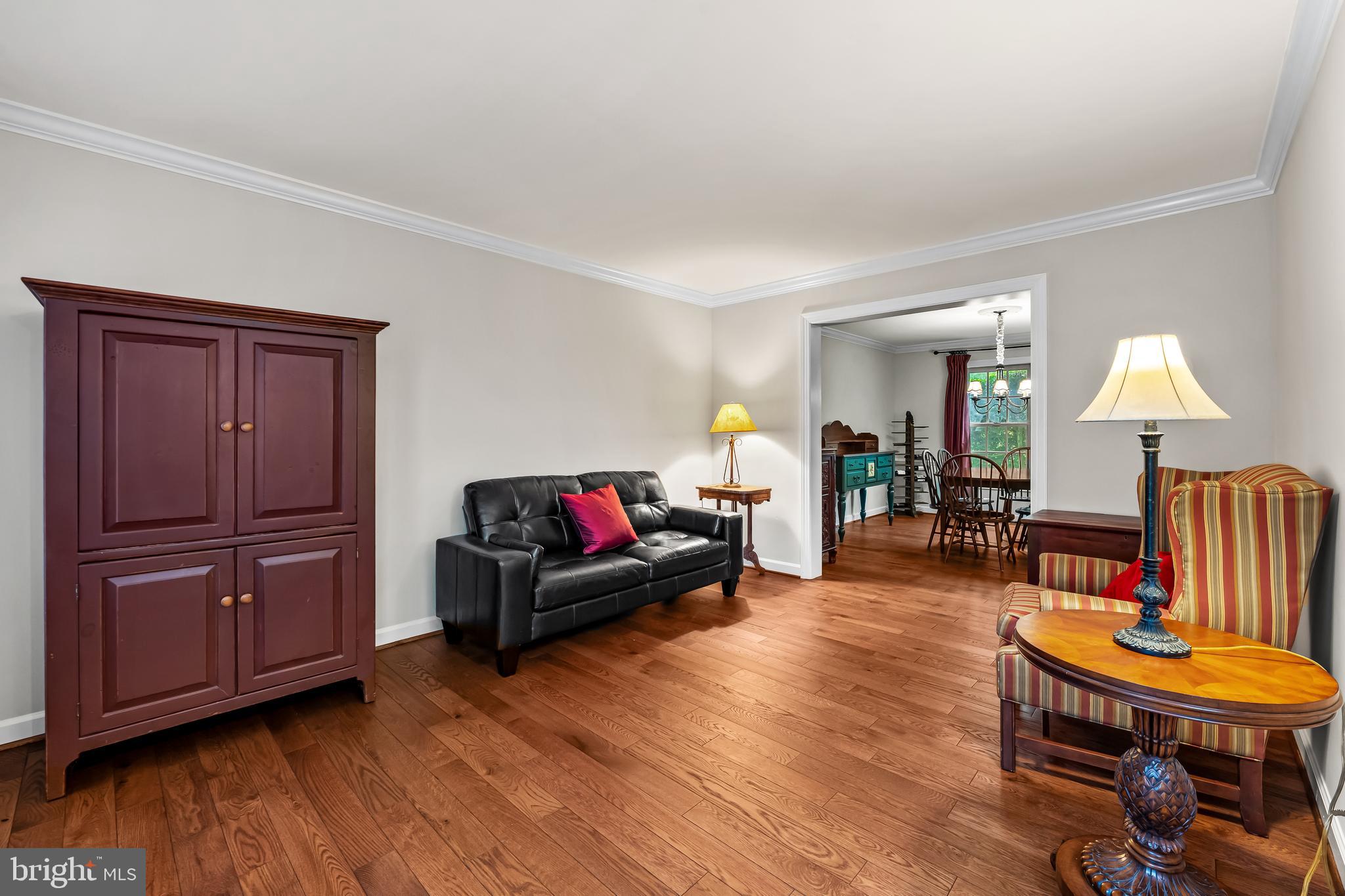 8315 Saddle Ridge Terrace Ellicott City, MD 21043 - Photo 12 of 62 a living room with furniture and a wooden floor