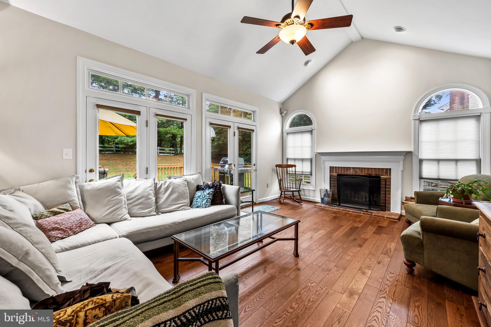 8315 Saddle Ridge Terrace Ellicott City, MD 21043 - Photo 23 of 62 a living room with furniture fireplace and window