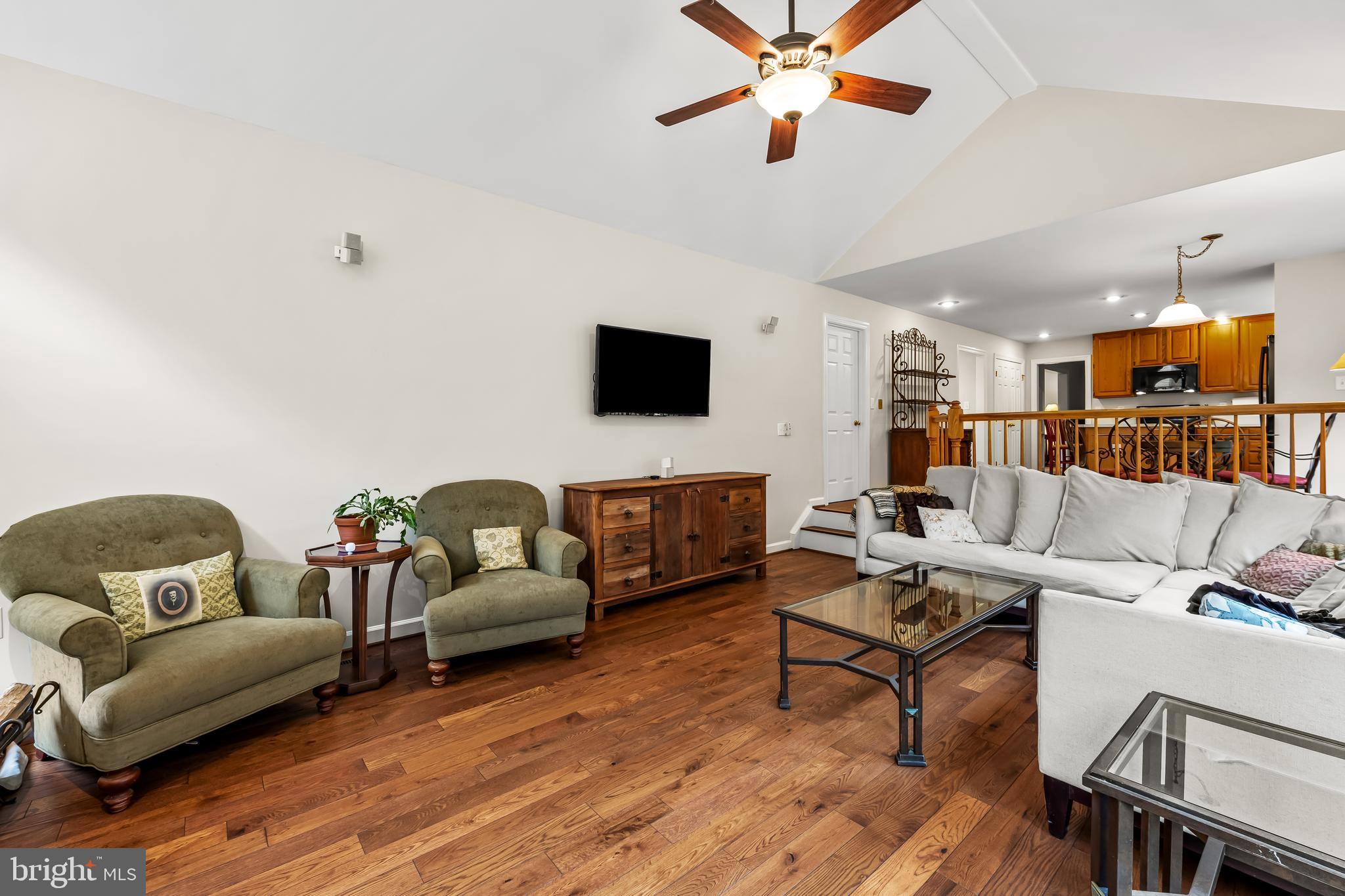 8315 Saddle Ridge Terrace Ellicott City, MD 21043 - Photo 24 of 62 a living room with furniture and a flat screen tv