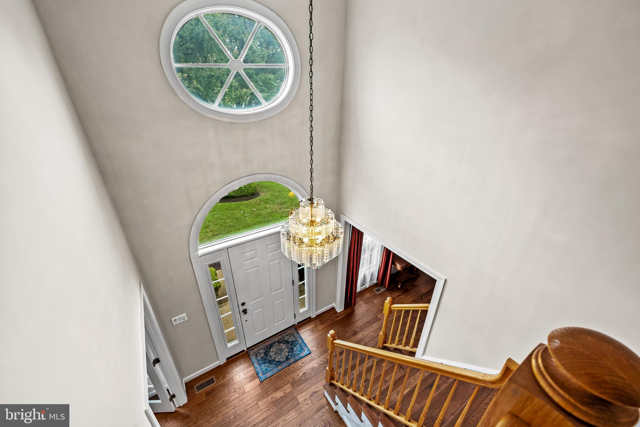 8315 Saddle Ridge Terrace Ellicott City, MD 21043 - Photo 26 of 62 a view of an entryway with wooden floor