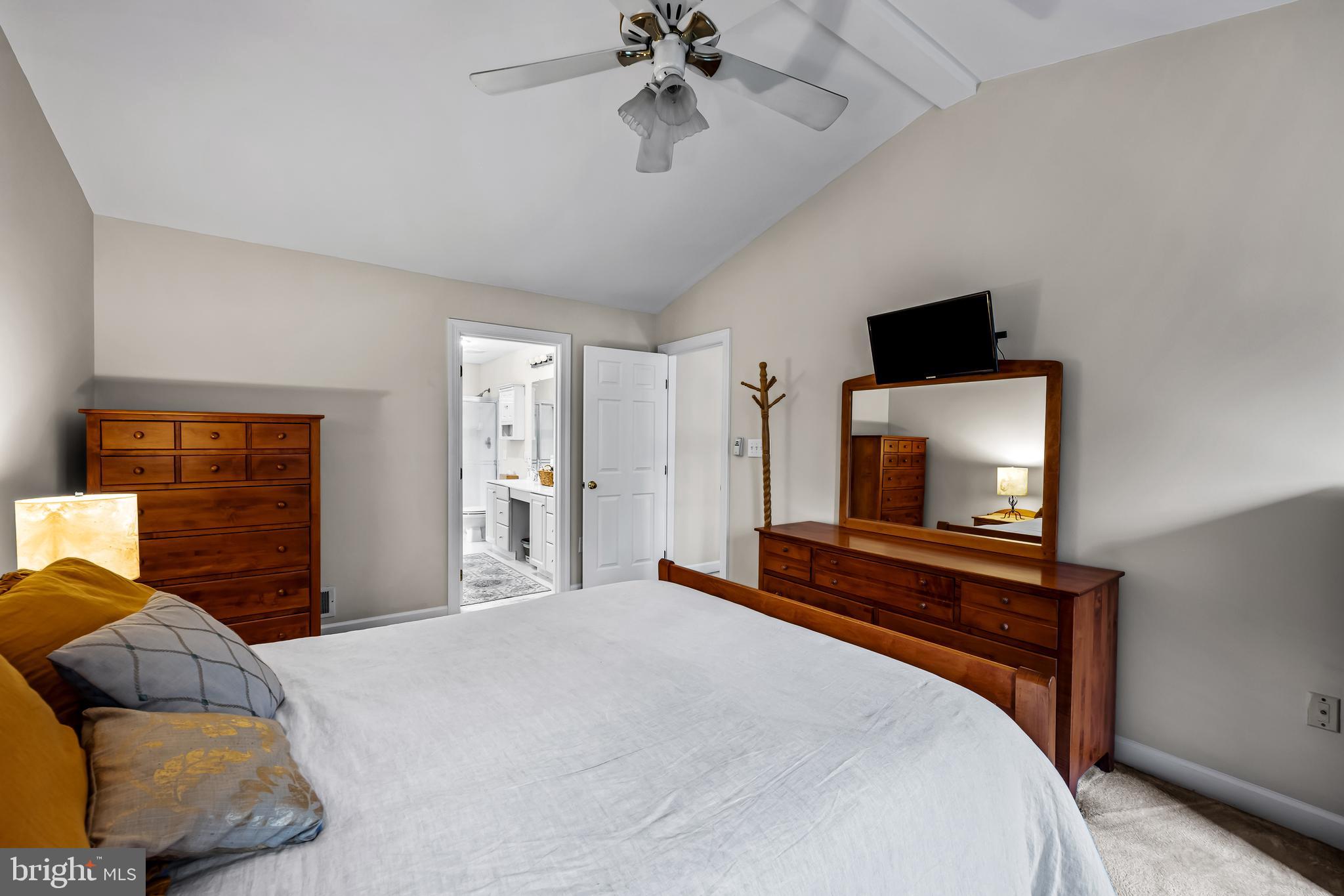 8315 Saddle Ridge Terrace Ellicott City, MD 21043 - Photo 37 of 62 a bedroom with a bed and a flat screen tv