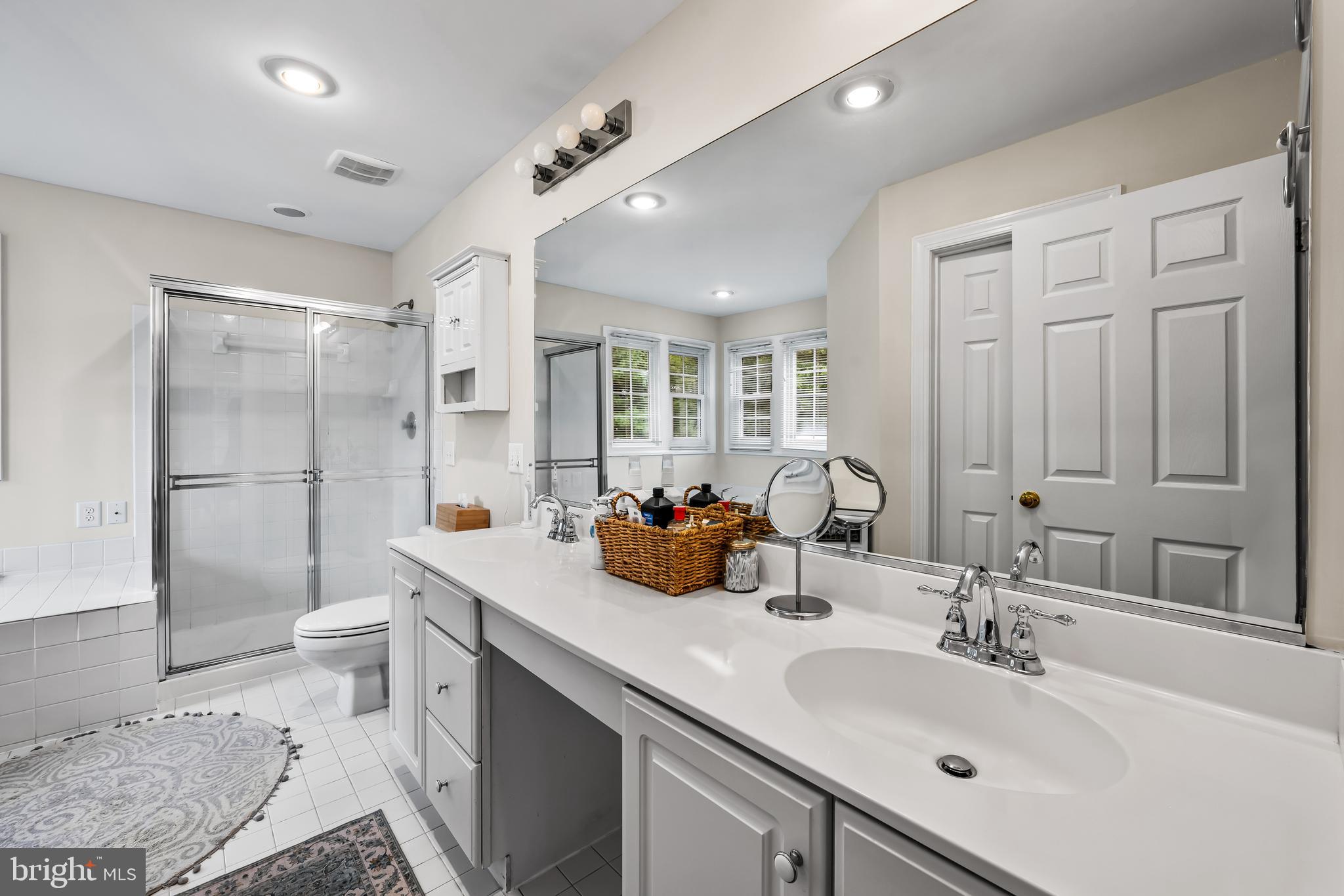 8315 Saddle Ridge Terrace Ellicott City, MD 21043 - Photo 38 of 62 a bathroom with a double vanity sink mirror double and toilet