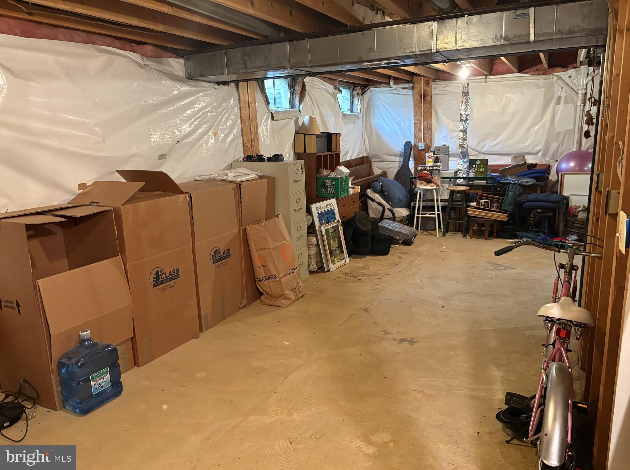 8315 Saddle Ridge Terrace Ellicott City, MD 21043 - Photo 44 of 62 a view of walk in closet with clothes and shoes