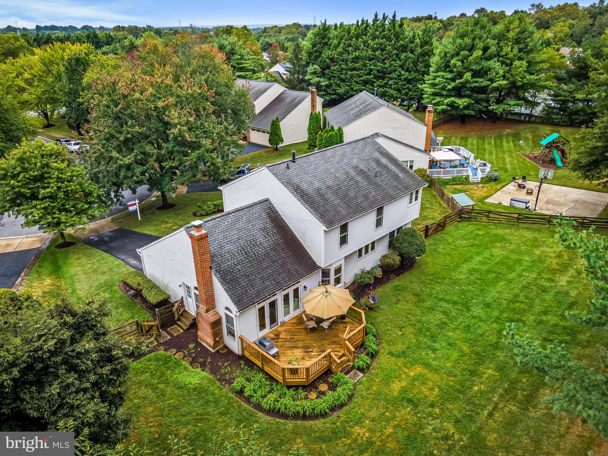 8315 Saddle Ridge Terrace Ellicott City, MD 21043 - Photo 59 of 62 an aerial view of a house with garden space and street view