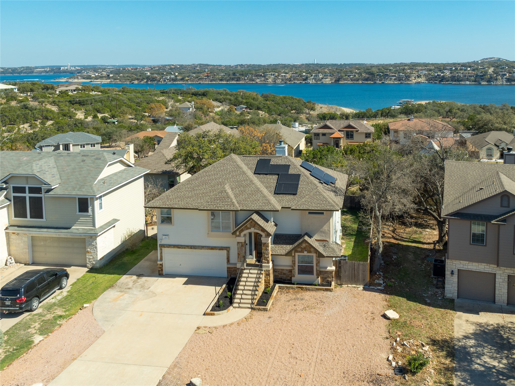 330 Southwind Road Point Venture, TX 78645 - Photo 1 of 37 Tucked into the hillside for extra privacy, this lake house is all about one thing, the views!