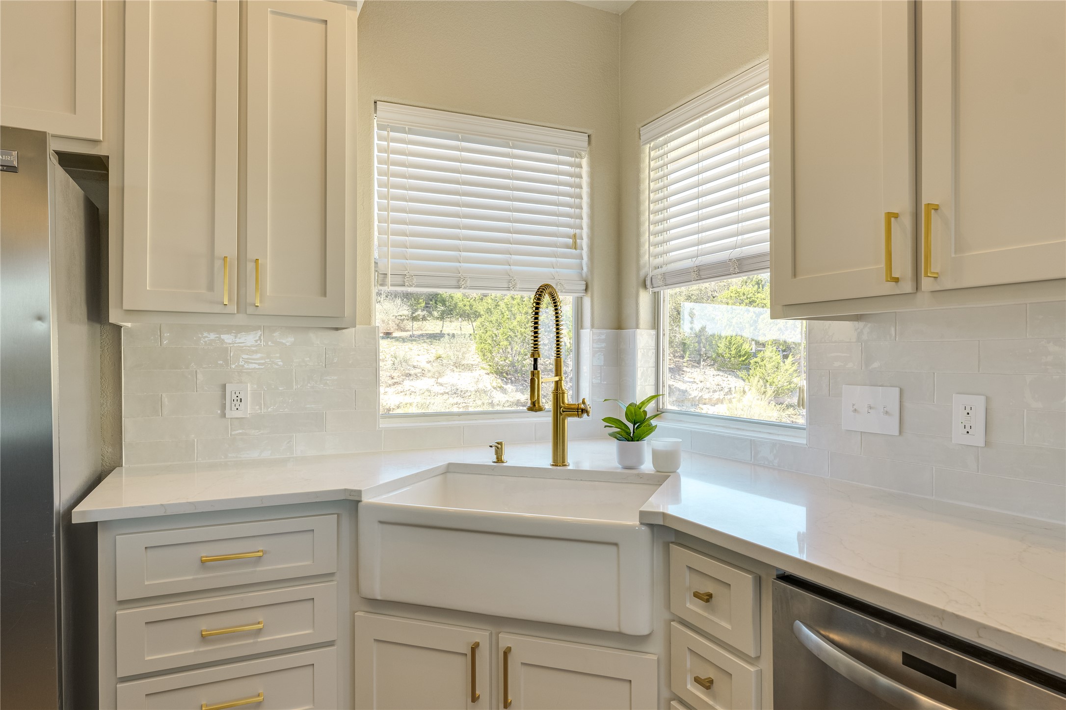 330 Southwind Road Point Venture, TX 78645 - Photo 12 of 37 Windows for backsplash makes washing dishes a little less boring.
