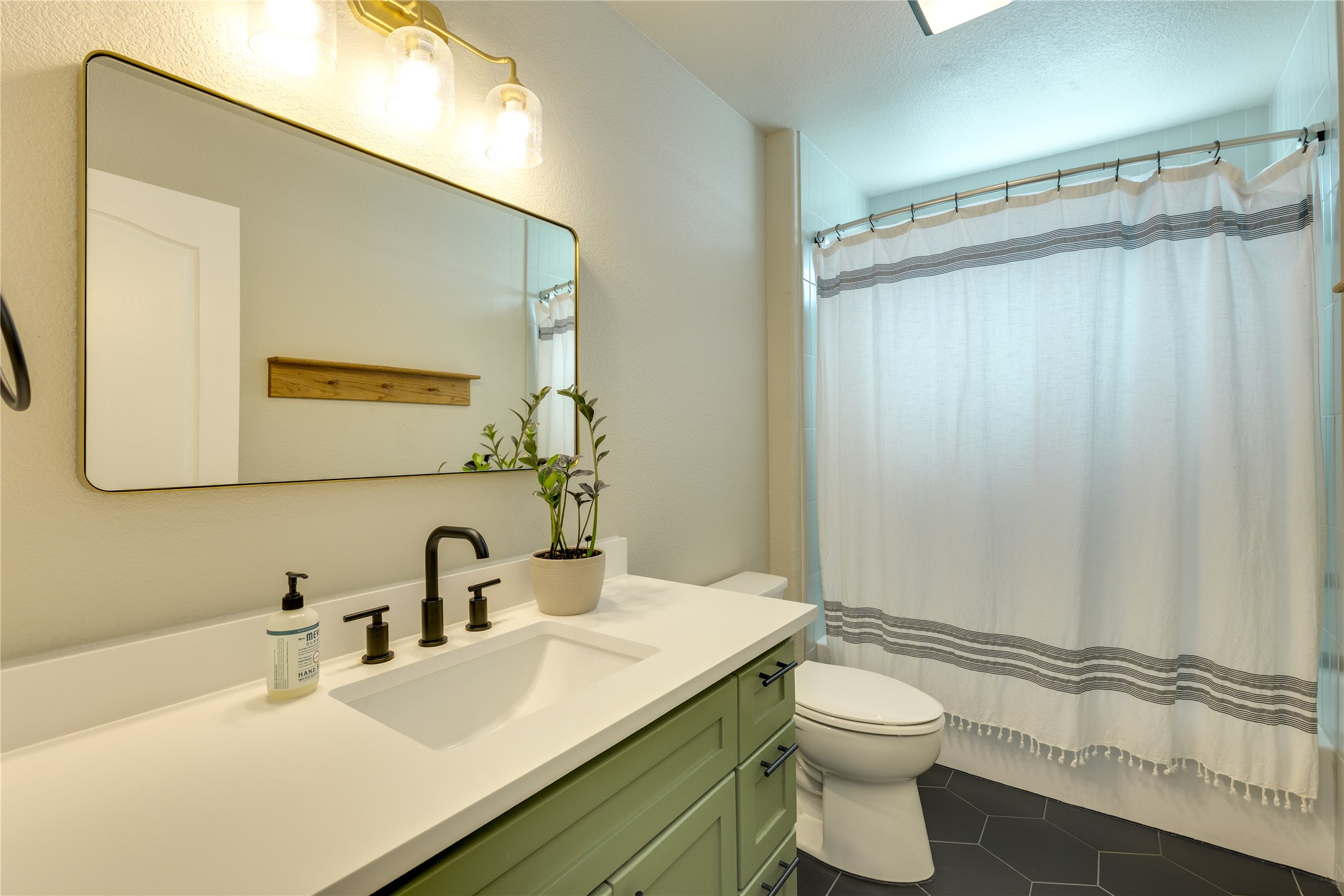 330 Southwind Road Point Venture, TX 78645 - Photo 21 of 37 Another full bath located on the lower level is simple and functional.