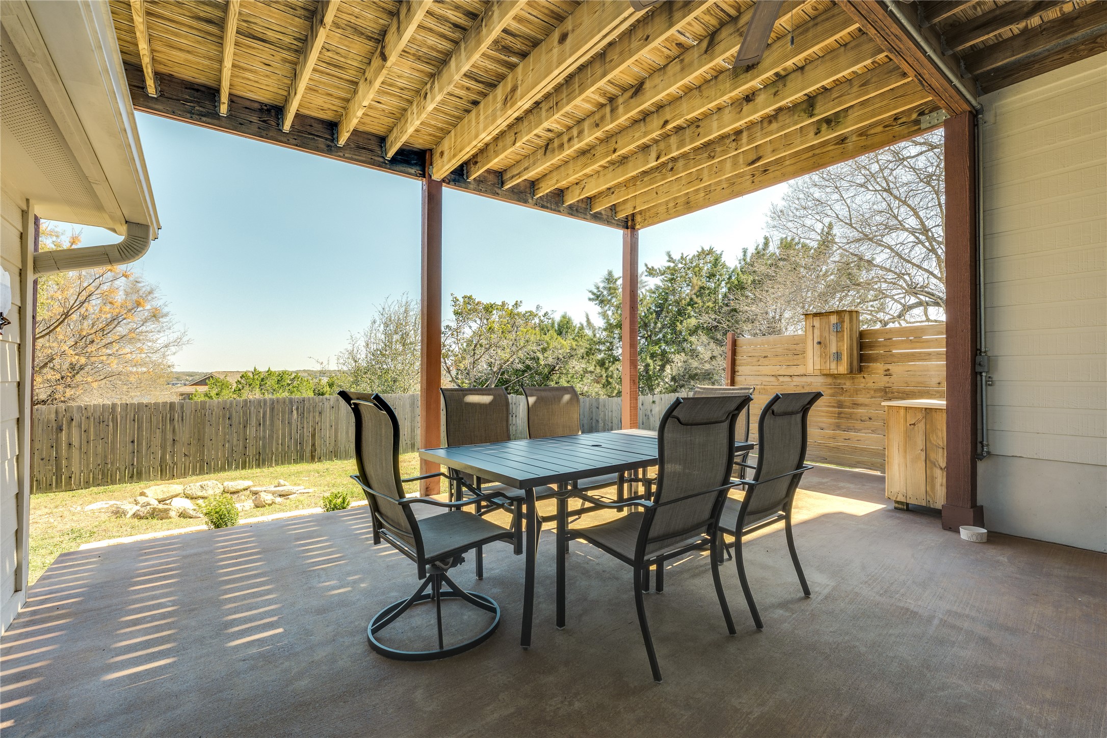 330 Southwind Road Point Venture, TX 78645 - Photo 23 of 37 A lower-level covered patio made for lake-day wind-downs, shaded dining, and post-swim snacks (no sunburn required).