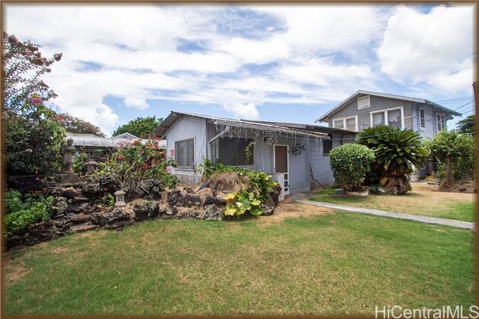 2993 Koali Road, Unit A Honolulu, HI 96826 - Photo 1 of 1 a front view of a house with garden