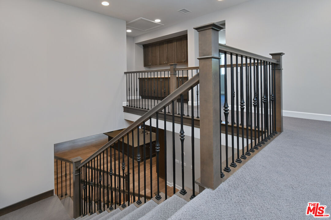 14608 McCormick Street Sherman Oaks, CA 91411 - Photo 13 of 29 a view of staircase with railing and white walls