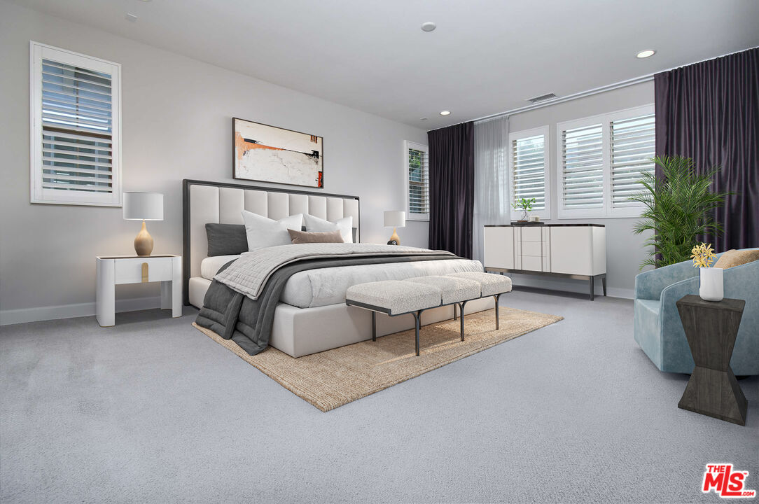 14608 McCormick Street Sherman Oaks, CA 91411 - Photo 21 of 29 a spacious bedroom with a bed and a couch