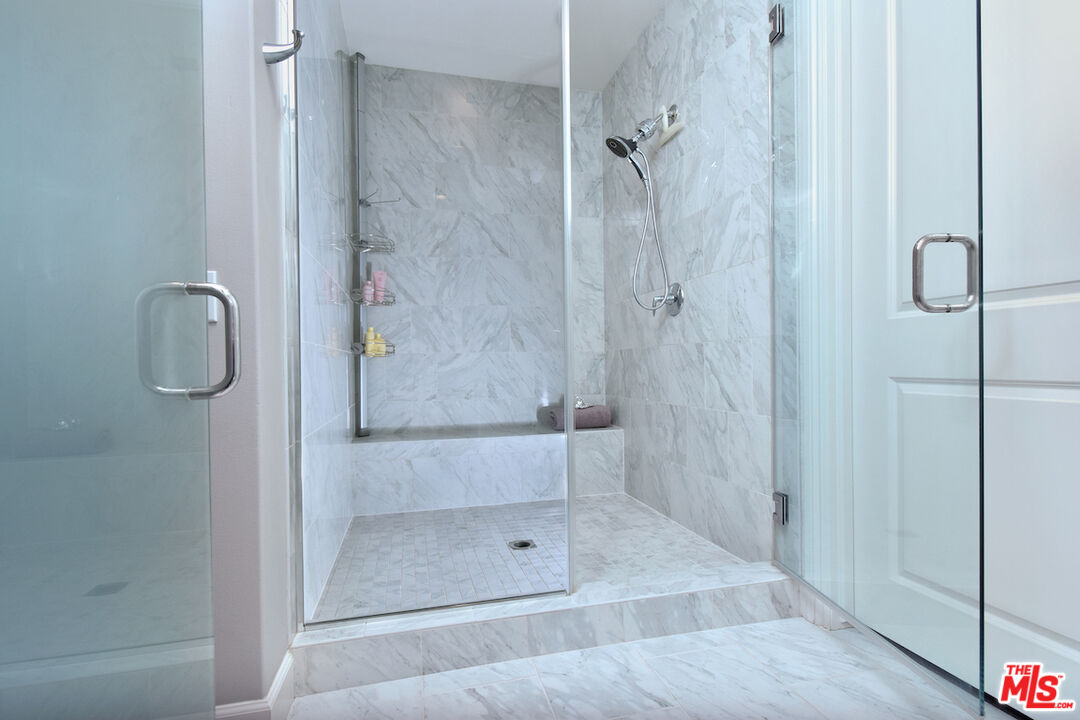14608 McCormick Street Sherman Oaks, CA 91411 - Photo 22 of 29 a bathroom with a glass shower door