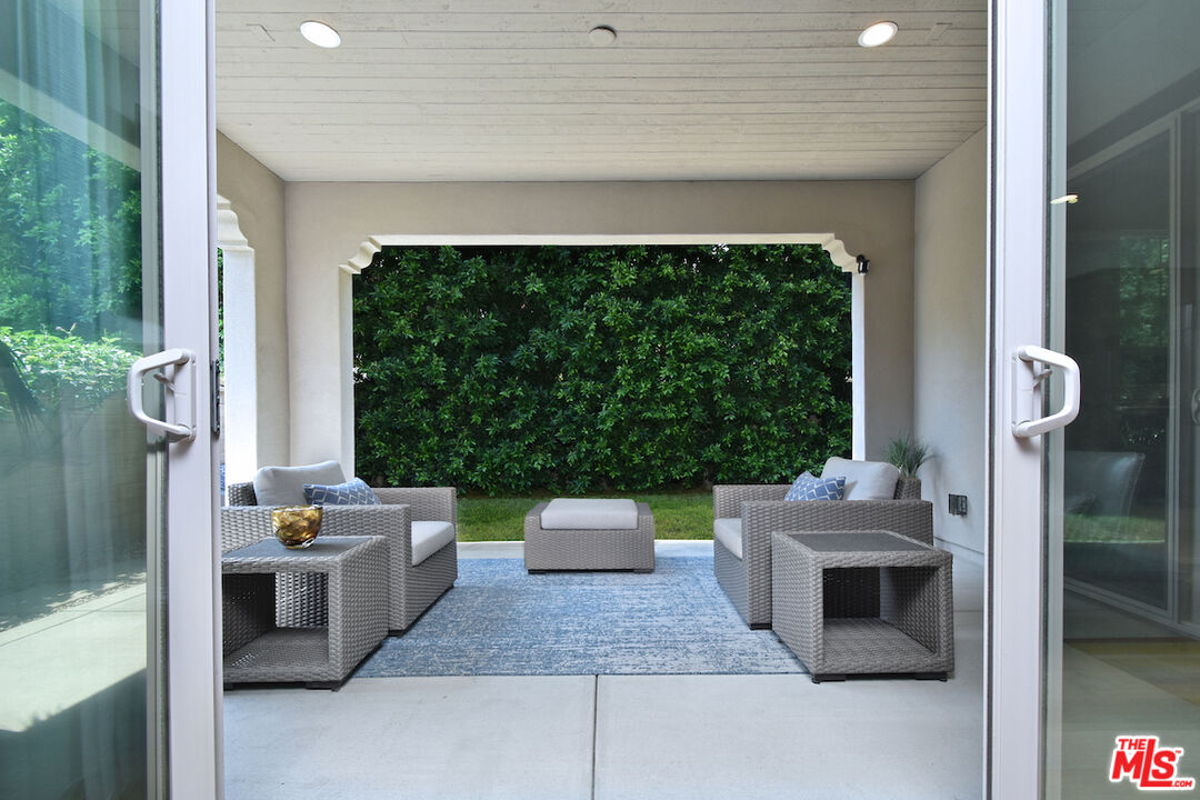 14608 McCormick Street Sherman Oaks, CA 91411 - Photo 23 of 29 a living room with furniture and a fireplace
