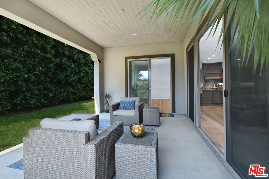 14608 McCormick Street Sherman Oaks, CA 91411 - Photo 25 of 29 a view of patio with couches table and chairs and garden
