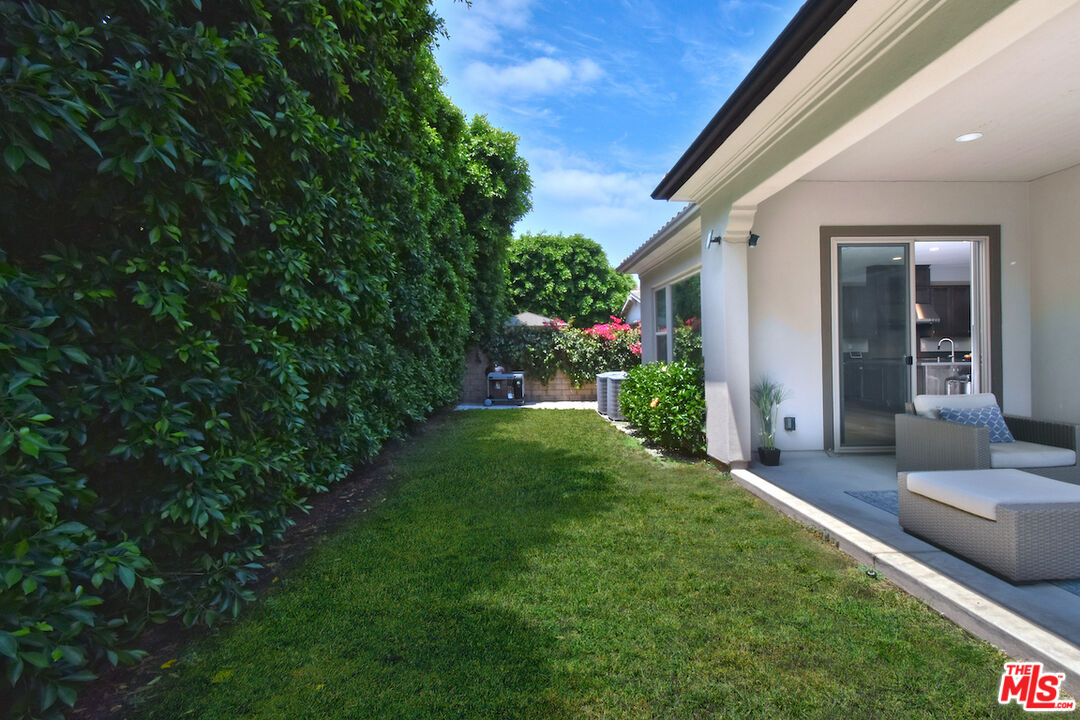14608 McCormick Street Sherman Oaks, CA 91411 - Photo 26 of 29 a view of an house with backyard space and garden