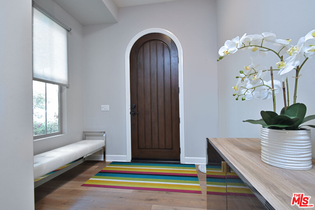 14608 McCormick Street Sherman Oaks, CA 91411 - Photo 3 of 29 a view of hall way with furniture and chandelier